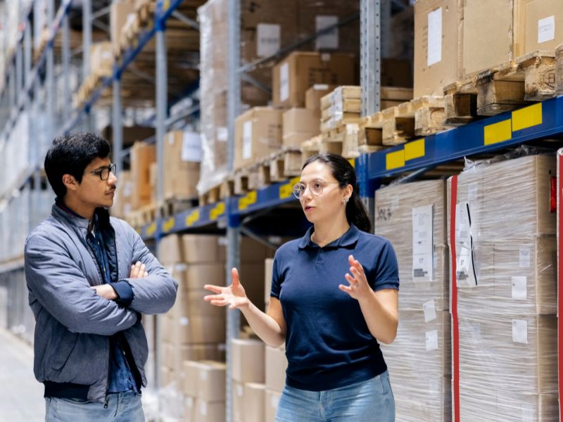 employees discussing supply chain